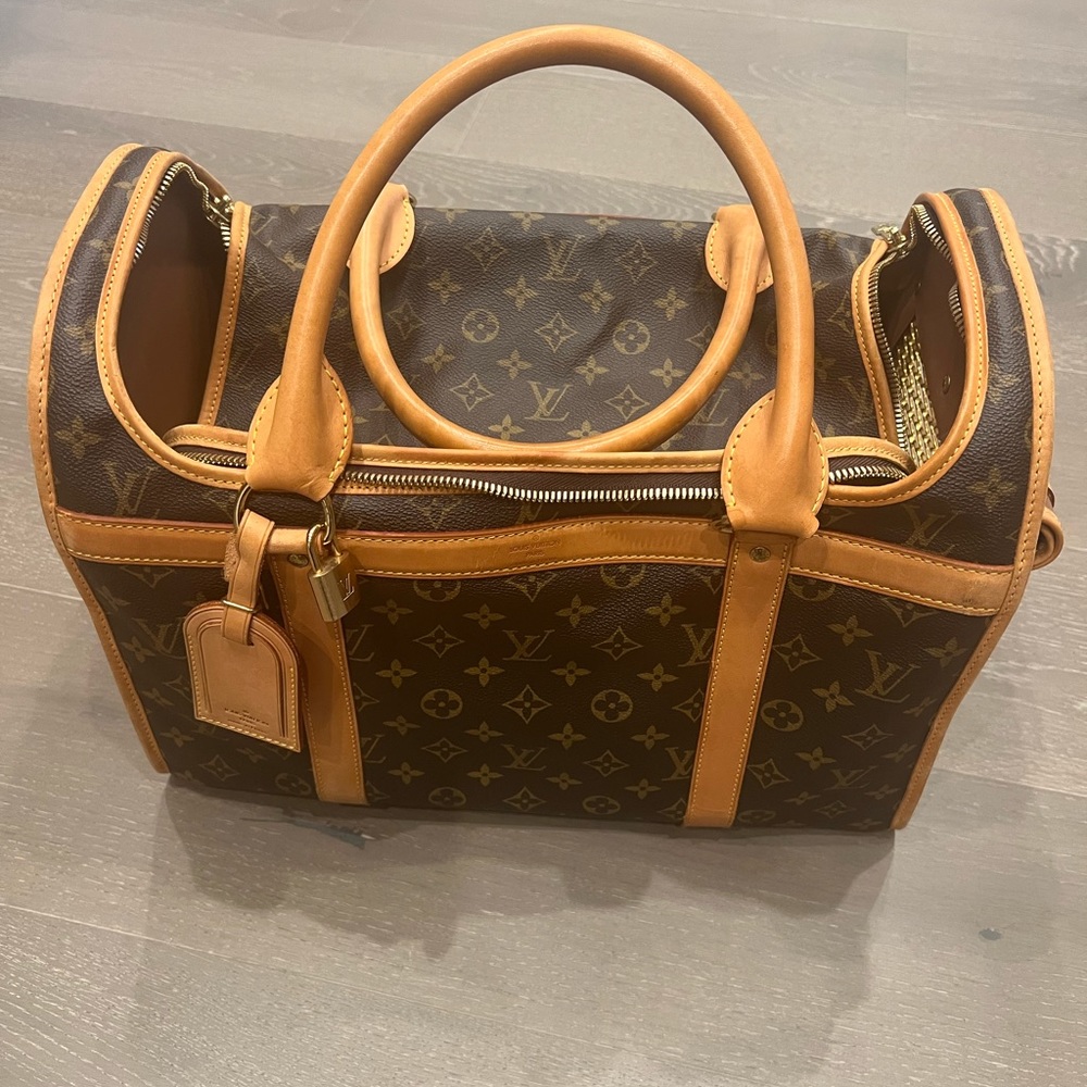 LV dog carrier bad. It’s slightly bitten by my dog on the inside. .